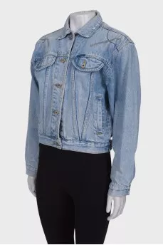 Denim jacket with a pattern on the back