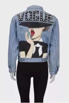 Denim jacket with a pattern on the back