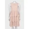 Dress with ruffles at the hem
