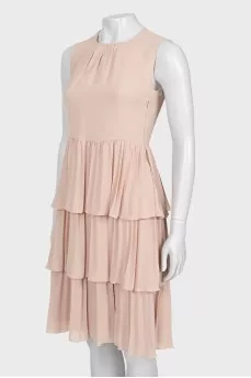 Dress with ruffles at the hem