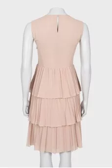 Dress with ruffles at the hem