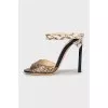 Sandals with embossed stilettos
