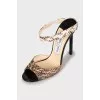 Sandals with embossed stilettos