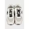 Black and white sneakers with brand logo