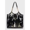 Patent bag with appliqué