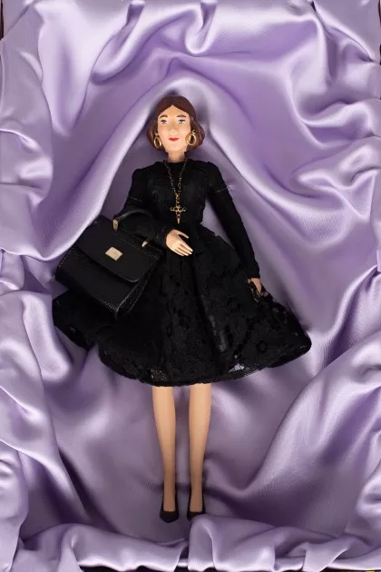 Porcelain doll in a dress