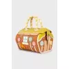 Leather bag decorated with appliqué
