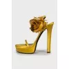 Yellow sandals decorated with flowers