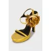 Yellow sandals decorated with flowers