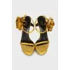 Yellow sandals decorated with flowers