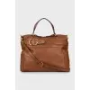 Brown bag with gold hardware