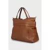 Brown bag with gold hardware
