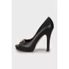 Signature embossed leather pumps