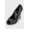 Signature embossed leather pumps
