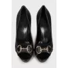 Signature embossed leather pumps