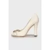White shoes with golden logo