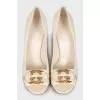 White shoes with golden logo
