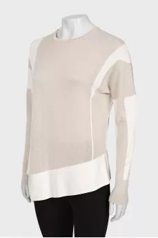 Sweater with asymmetric hem