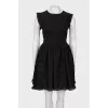 Black dress with a pattern and frills
