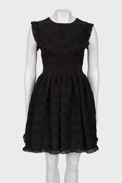 Black dress with a pattern and frills