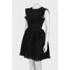 Black dress with a pattern and frills