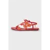 Red sandals decorated with rhinestones