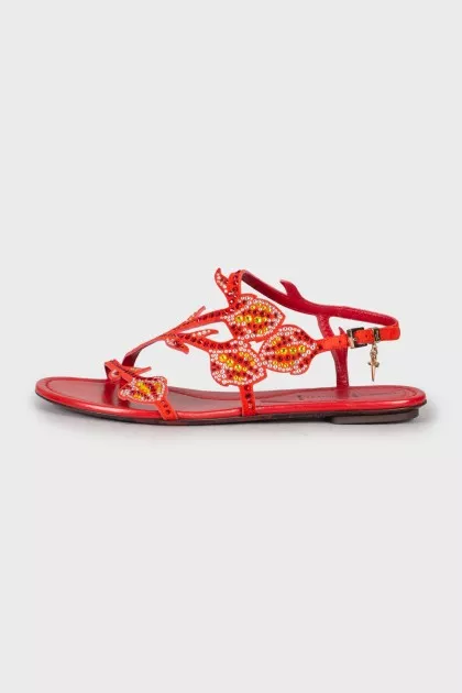 Red sandals decorated with rhinestones