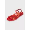 Red sandals decorated with rhinestones