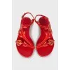 Red sandals decorated with rhinestones
