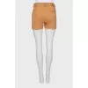 Beige shorts with buttons