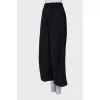 Black trousers with drawstring bottom