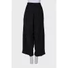 Black trousers with drawstring bottom