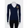 Navy blue sweater with embroidered logo