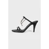 Leather sandals with metallic decoration