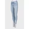 Light blue raw hem jeans