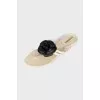 White slippers decorated with flowers
