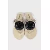White slippers decorated with flowers