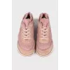 Pink sneakers with brand logo