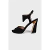 Suede sandals with figured heels