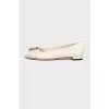 Leather flats with golden logo