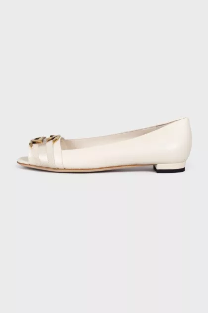 Leather flats with golden logo