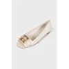 Leather flats with golden logo