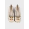 Leather flats with golden logo