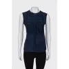 Sleeveless blouse with appliqué