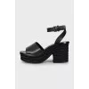 Black sandals with woven soles