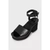 Black sandals with woven soles