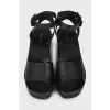 Black sandals with woven soles