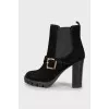 Buckle-decorated suede ankle boots
