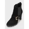 Buckle-decorated suede ankle boots