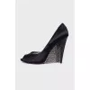 Black shoes decorated with rhinestones